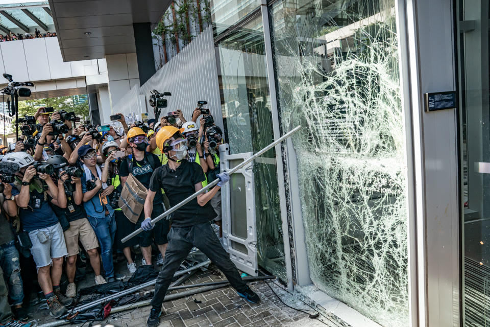 Protesters smash glass doors and windows of the Legislative Council Complex on July 1, 2019 in Hong Kong, China.  (Photo: Anthony Kwan/Getty Images)