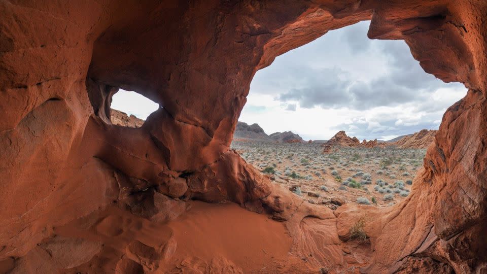 Sculptural rock formations along the Redstone Dune Trail look out over Lake Mead National Recreation Area. - National Park Service