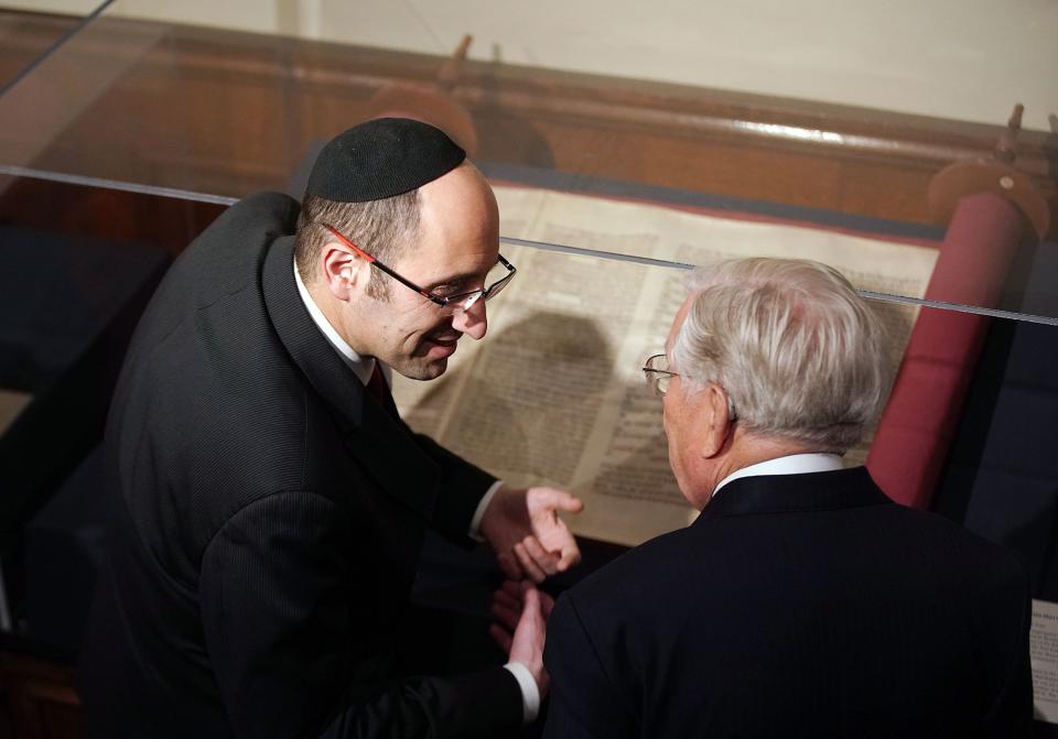 Rabbi Meir Y. Soloveichik, left, talks with President M. Russell Ballard, acting president of the Quorum of the Twelve Apostles of The Church of Jesus Christ of Latter-day Saints, as they look at Torah scrolls at the Spanish and Portuguese Synagogue of the Congregation Shearith Israel in New York City on Friday, Nov. 15, 2019. | Ravell Call, Deseret News