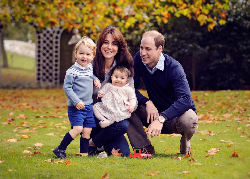 <p>The little Princess appears in her first family photo, taken in the grounds of Kensington Palace.<br><i>[Photo: PA]</i> </p>