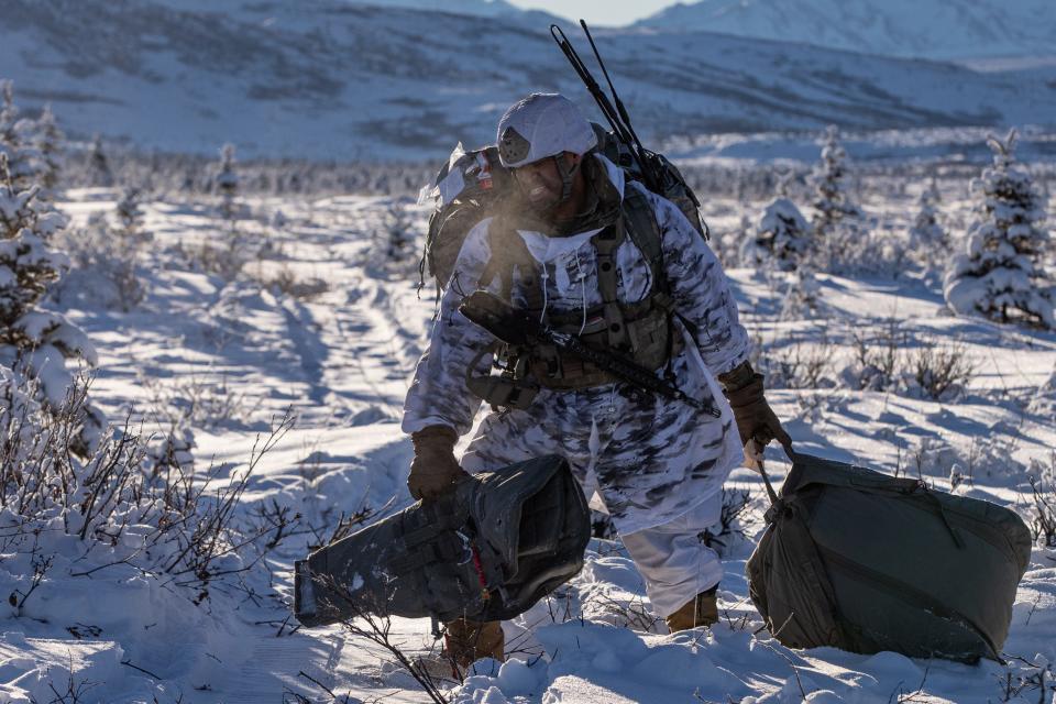 A U.S. Army Soldier from 3rd Battalion, 509th Parachute Infantry Regiment, 2nd Infantry Brigade Combat Team (Airborne), 11th Airborne Division, leaves Donnelly Drop Zone after airborne operations as part of Joint Pacific Multinational Readiness Center 24-02 at Donnelly Training Area, Alaska, Feb 8, 2024.