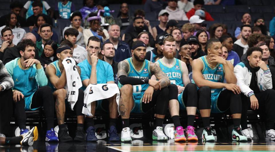 Members of the Charlotte Hornets sit on the team’s bench dejected in the closing moments of second-half action against the Dallas Mavericks on Tuesday, April 9, 2024 at Spectrum Center in Charlotte, NC. The Mavericks defeated the Hornets 130-104.