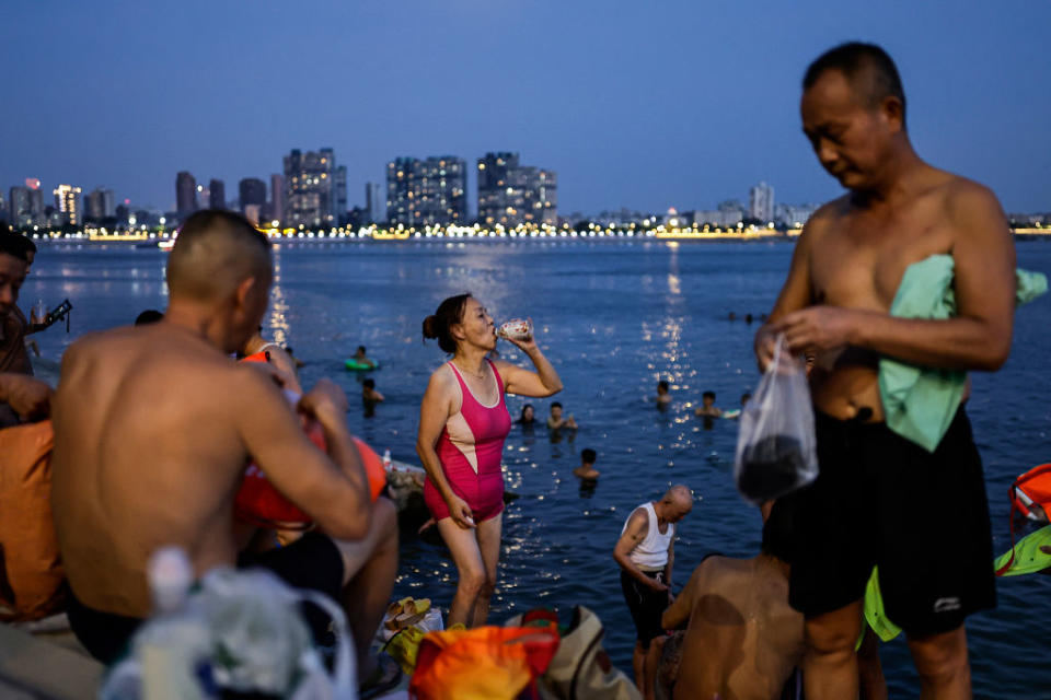 People swim in the intersection of the Han and Yangtze rivers during a heat wave on August 10, 2022 in Wuhan, Hubei Province, China.<span class="copyright">Getty Images</span>