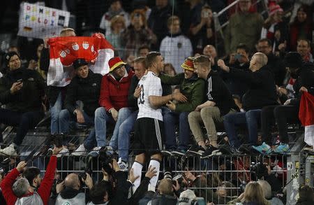 Football Soccer - Germany v England - International Friendly - Signal-Iduna-Park, Dortmund, Germany - 22/3/17 Germany's Lukas Podolski celebrates with fans after his final appearance for his country Action Images via Reuters / Carl Recine Livepic