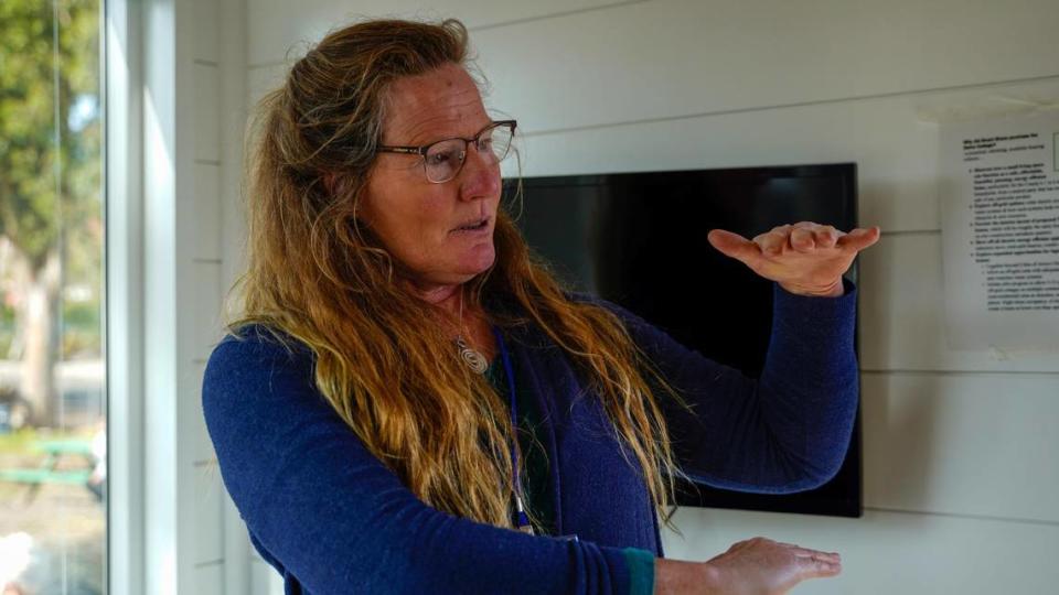 Smart Share Housing Solutions executive director Anne Wyatt speaks to visitors in the model tiny home at the Waterman Village project, which would would turn Rosa Burton de Canet Adobe, a historic property on Dana Street near the San Luis Obispo Children’s Museum, into 20 units of affordable tiny homes.