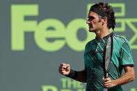 Mar 27, 2017; Miami, FL, USA; Roger Federer of Switzerland celebrates after winning match point against Juan Martin del Potro of Argentina (not pictured) on day seven of the 2017 Miami Open at Crandon Park Tennis Center. Mandatory Credit: Geoff Burke-USA TODAY Sports