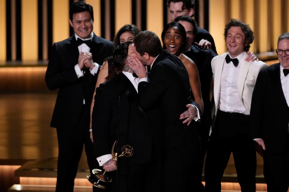 Ebon Moss-Bachrach kisses Matty Matheson as he accepts the award for best comedy series for ‘The Bear’ during the 75th Emmy Awards.