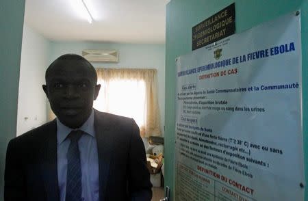 Dr. Daouda Coulibaly, the head of epidemiological monitoring service of the National Institute for Public Health of Côte d'Ivoire (INHP) in charge of Ebola, leaves his office after an interview with Reuters in Abidjan September 8, 2014. REUTERS/Luc Gnago