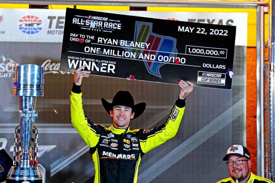 May 22, 2022; Fort Worth, Texas, USA; NASCAR Cup Series driver Ryan Blaney (12) celebrates in Victory lane after winning the All-Star Race at Texas Motor Speedway.