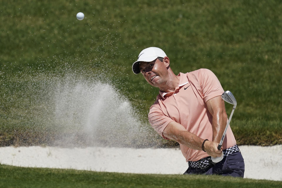 Rory McIlroy, of Northern Ireland, chips into the hole for a birdie on the 16th green during the final round of the Charles Schwab Challenge golf tournament at the Colonial Country Club in Fort Worth, Texas, Sunday, June 14, 2020. (AP Photo/David J. Phillip)