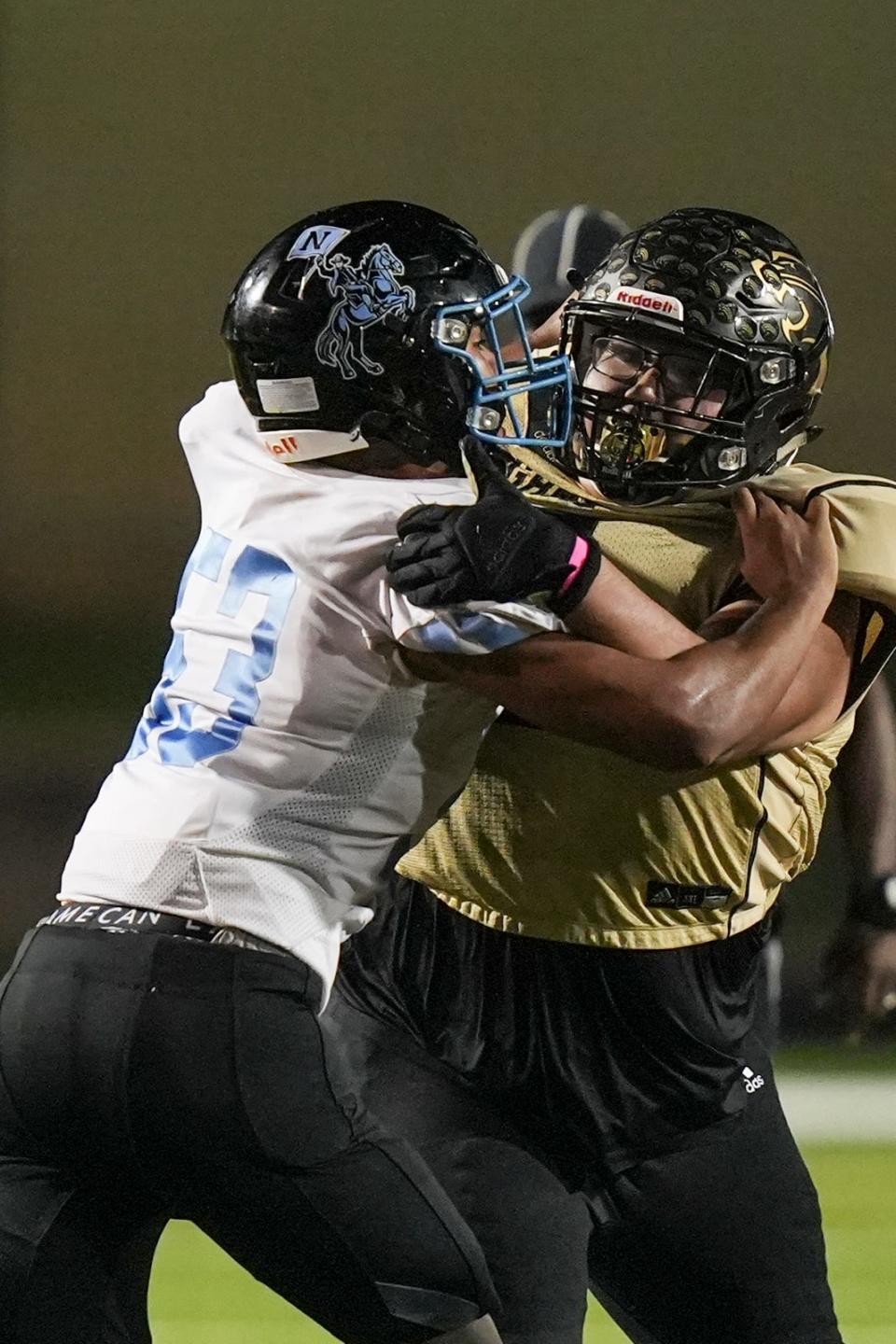 Crockett High School defensive tackle Amado Peña-Gonzalez, right, weighed 425 pounds when he entered high school as a freshman. He is down to 295 as a senior and recently accepted an offer to play football at Southwestern University.