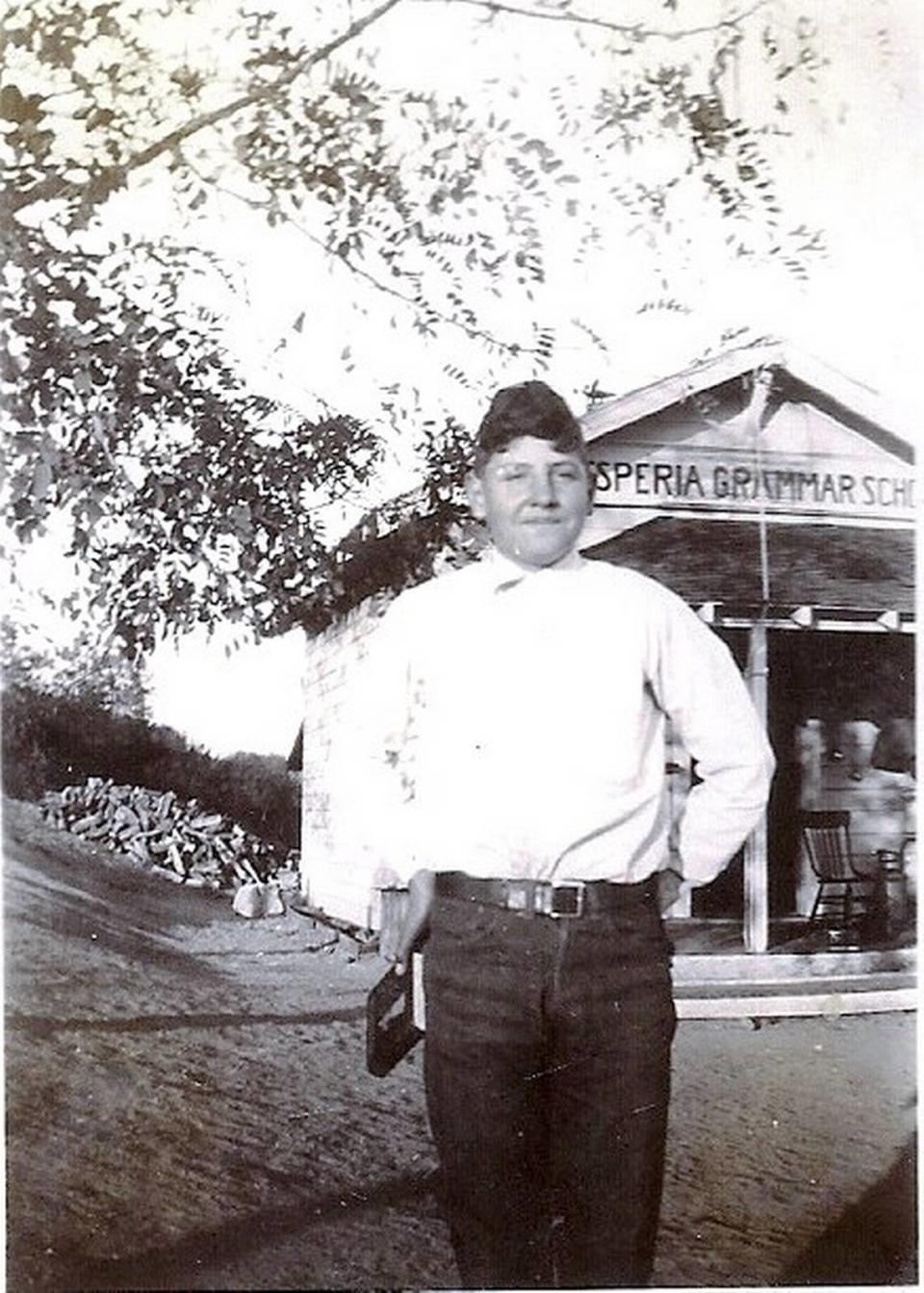 Glenn Harris as a child pictured in front of the Hesperia Grammar School in Bradley, California. Harris would die at the age of 26 while serving in the Philippines in World War II.