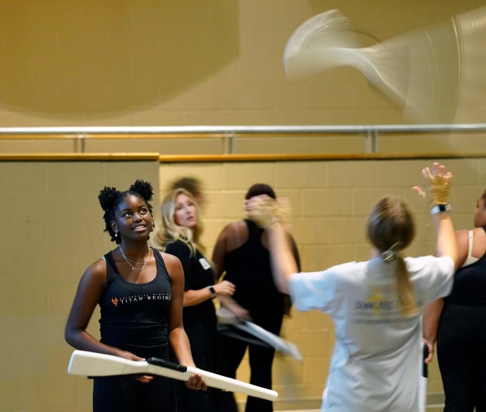 University High School color guard performs during a ceremony at the school to invite the band to perform in the 2024 London New Year's Day parade, Wednesday, Nov. 16, 2022.