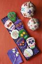 <p>Serve these colorful frosted cookies at your Halloween party and it's sure to be a hit.</p><p><strong><a rel="nofollow noopener" href="https://www.womansday.com/food-recipes/food-drinks/a23569445/cookie-skulls-and-pumpkin-sugar-cookie-cutouts-recipe/" target="_blank" data-ylk="slk:Get the recipe;elm:context_link;itc:0;sec:content-canvas" class="link ">Get the recipe</a>. </strong></p>