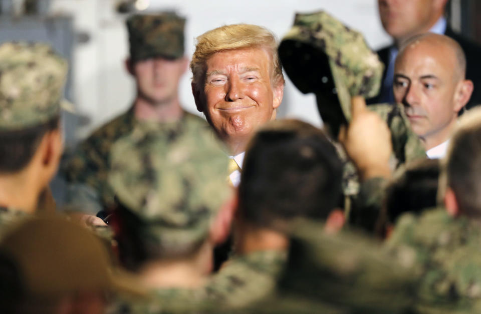 President Trump greets service members  aboard the USS Wasp in Yokosuka, Japan. (Photo: Eugene Hoshiko/AP)