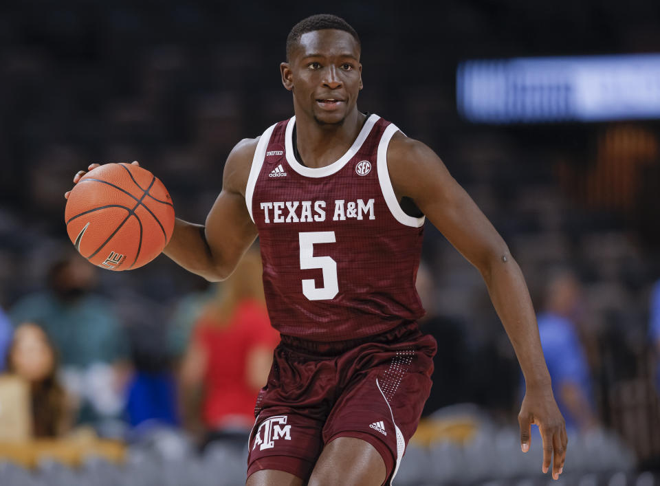 LAS VEGAS, NV - NOVEMBER 22:  Hassan Diarra #5 of the Texas A&M Aggies brings the ball up court at Michelob ULTRA Arena on November 22, 2021 in Las Vegas, Nevada. (Photo by Michael Hickey/Getty Images)