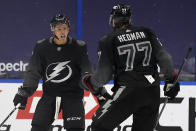 Tampa Bay Lightning right wing Mathieu Joseph (7) celebrates his goal against the Florida Panthers with defenseman Victor Hedman (77) during the third period of an NHL hockey game Saturday, April 17, 2021, in Tampa, Fla. (AP Photo/Chris O'Meara)