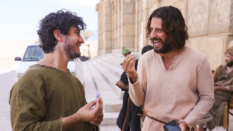 George Harrison Xanthis, who plays John, laughs with Jonathan Roumie, who plays Jesus, on the set of “The Chosen.”