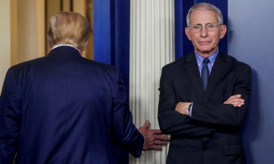 Trump departs after addressing the coronavirus task force daily briefing with Dr Anthony Fauci, 26 March 2020.