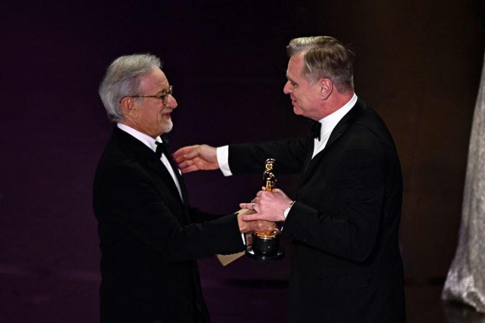 Christopher Nolan accepting his Oscar from Steven Spielberg.