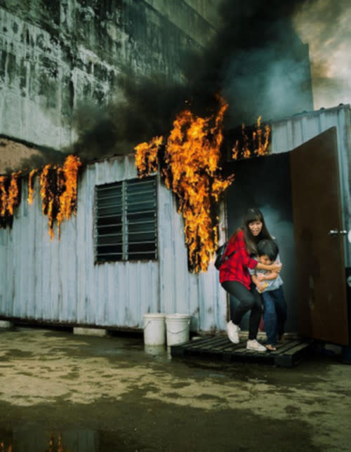 Sofia saving a boy from a burning shed