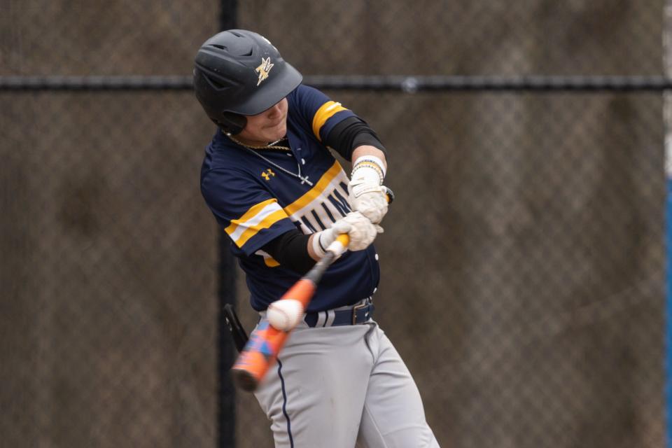 Tallmadge catcher Seth Yacobucci connects with the ball against Revere, Tuesday, April 25, 2023.