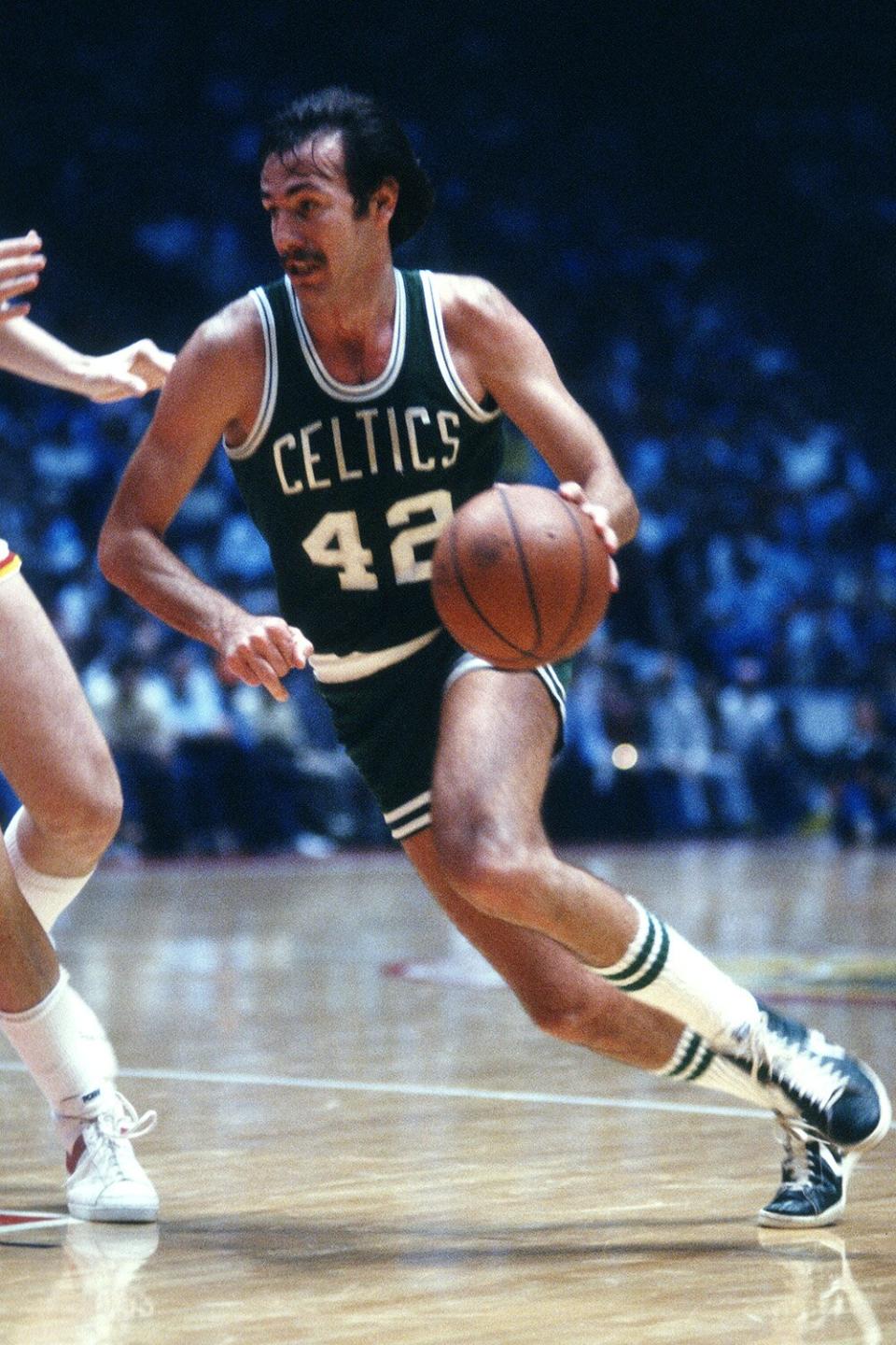 HOUSTON, TX - CIRCA 1979: Chris Ford #42 of the Boston Celtics drives towards the basket against the Houston Rockets during an NBA basketball game circa 1979 at The Summit in Houston, Texas. Ford played for the Celtics 1978-82. (Photo by Focus on Sport/Getty Images)