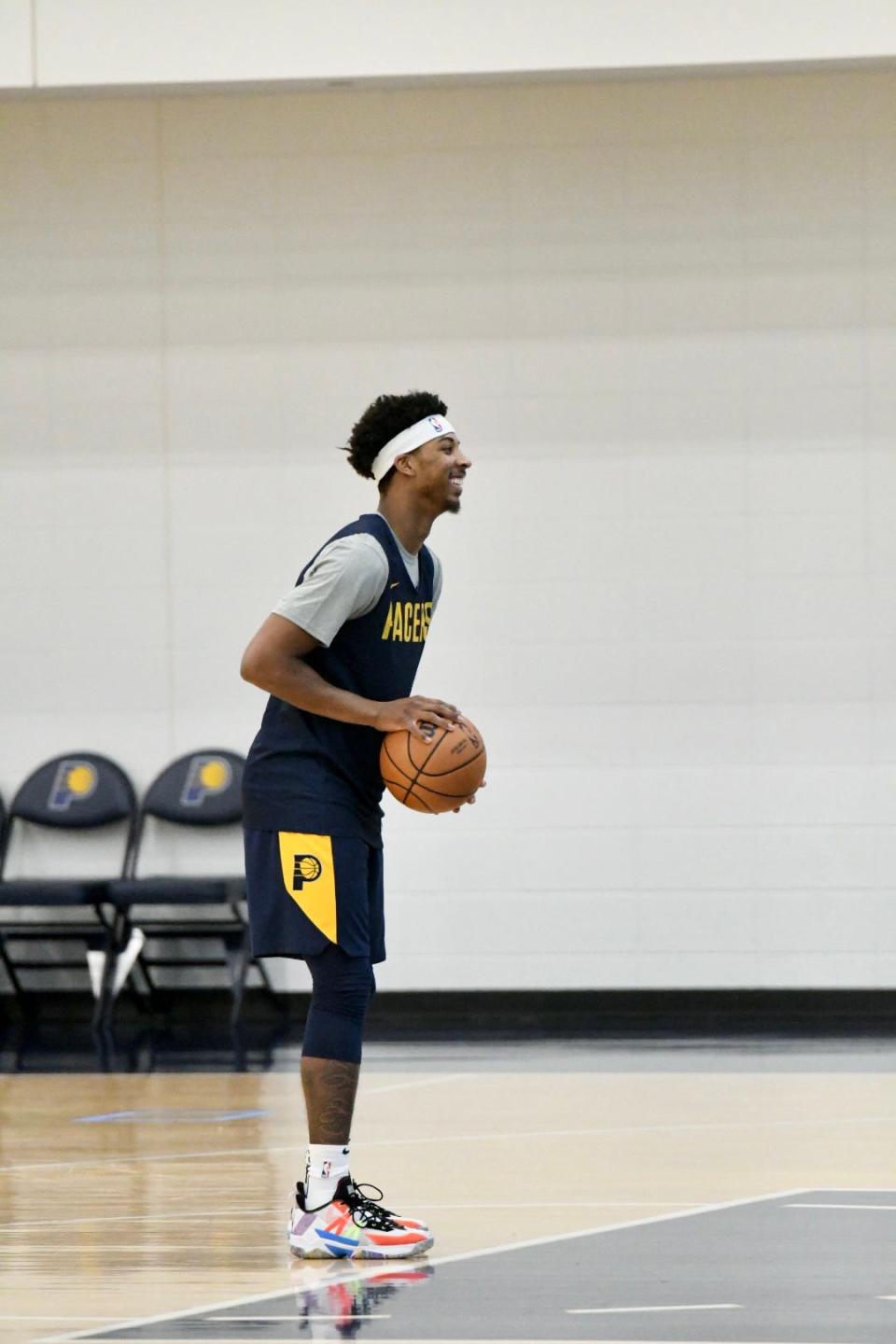 Nate Hinton smiles before shooting a free throw during Pacers practice at Ascension St. Vincent Center in Indianapolis on Dec. 30, 2021.