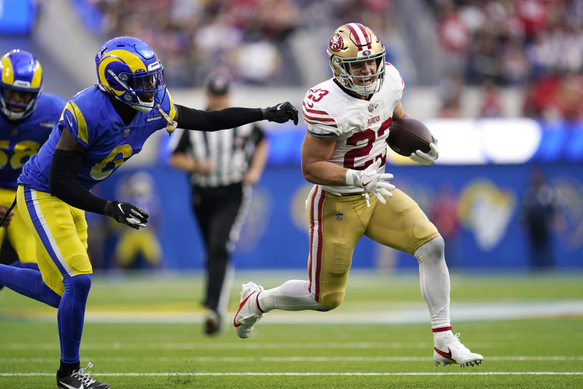 San Francisco 49ers running back Christian McCaffrey (23) sits on the  sideline during an NFL football game against the Denver Broncos, Saturday,  Aug 19, 2023, in Santa Clara, Calif. (AP Photo/Scot Tucker