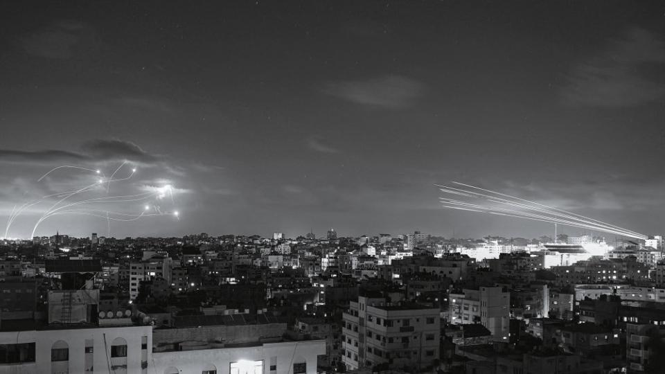 Rockets from Gaza approach Israel’s Iron Dome interceptors on Oct. 10.<span class="copyright">Eyad Baba—AFP/Getty Images</span>