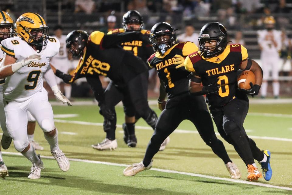 Tulare Union's Tieler Peterson rushes against Kingsburg in a non-league high school football game at Bob Mathias Stadium on Friday, September 22, 2023.