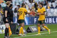 Matilda's Sam Kerr, right, is replaced by teammate Kyra Cooney-Cross during the international soccer match between the United States and Australia at Stadium Australia in Sydney, Saturday, Nov. 27, 2021. (AP Photo/Mark Baker)