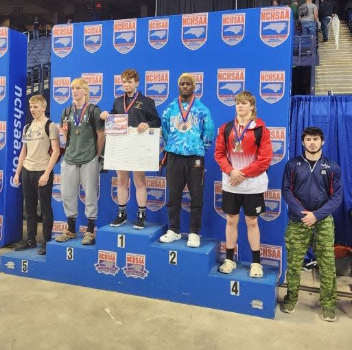 Southwest's Jeremiah Jones, second from right, is the state 2-A runner-up in the 160-pound weight class.
