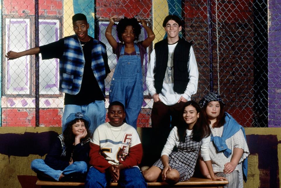 A throwback of the All That cast smiling for a group photo on set