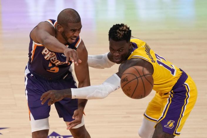 Jun 3, 2021; Los Angeles, California, USA; Phoenix Suns guard Chris Paul (3) is defended by Los Angeles Lakers guard Dennis Schroder (17) in the second half during game six in the first round of the 2021 NBA Playoffs at Staples Center. Mandatory Credit: Kirby Lee-USA TODAY Sports
