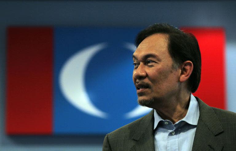 Malaysian opposition leader Anwar Ibrahim visits the Pakatan Rakyat Keadilan (PKR) headquarters for a press conference in Kuala Lumpur on January 3, 2012