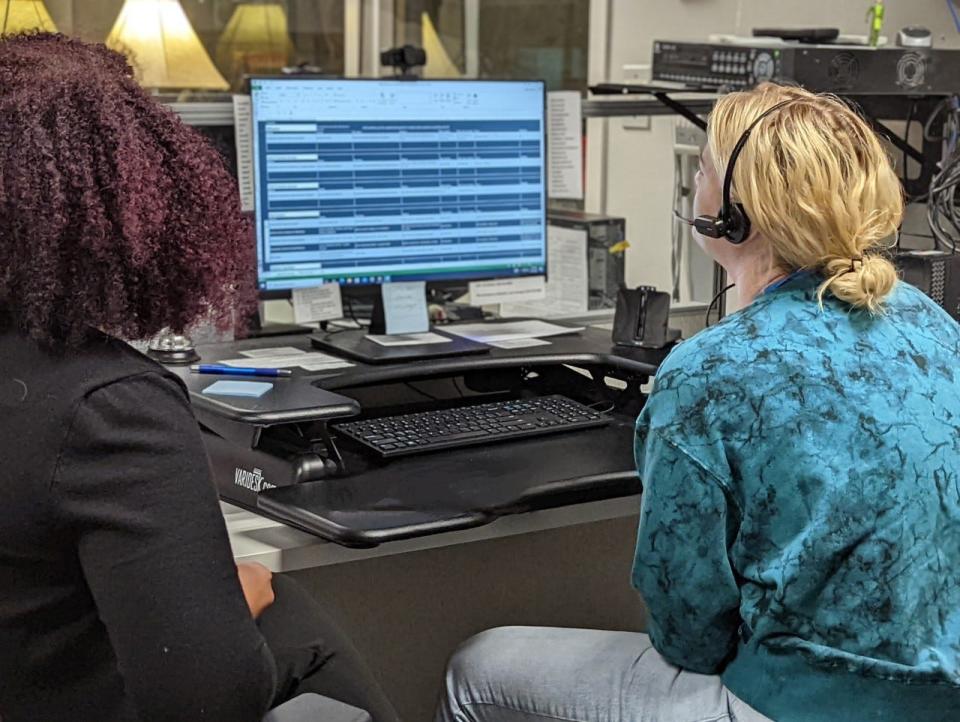 A counselor responds to a call at a National Suicide Prevention Lifeline call center.