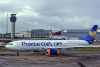 FILE - In this Aug. 13, 2019 file photo a Thomas Cook plane taxis on the runway at terminal one of Manchester Airport, England. More than 600,000 vacationers who booked through tour operator Thomas Cook were on edge Sunday, wondering if they will be able to get home, as one of the world's oldest and biggest travel companies teetered on the edge of collapse. The debt-laden company, which confirmed Friday it was seeking 200 million pounds ($250 million) in funding to avoid going bust, was in talks with shareholders and creditors to stave off failure. (Peter Byrne/PA via AP)