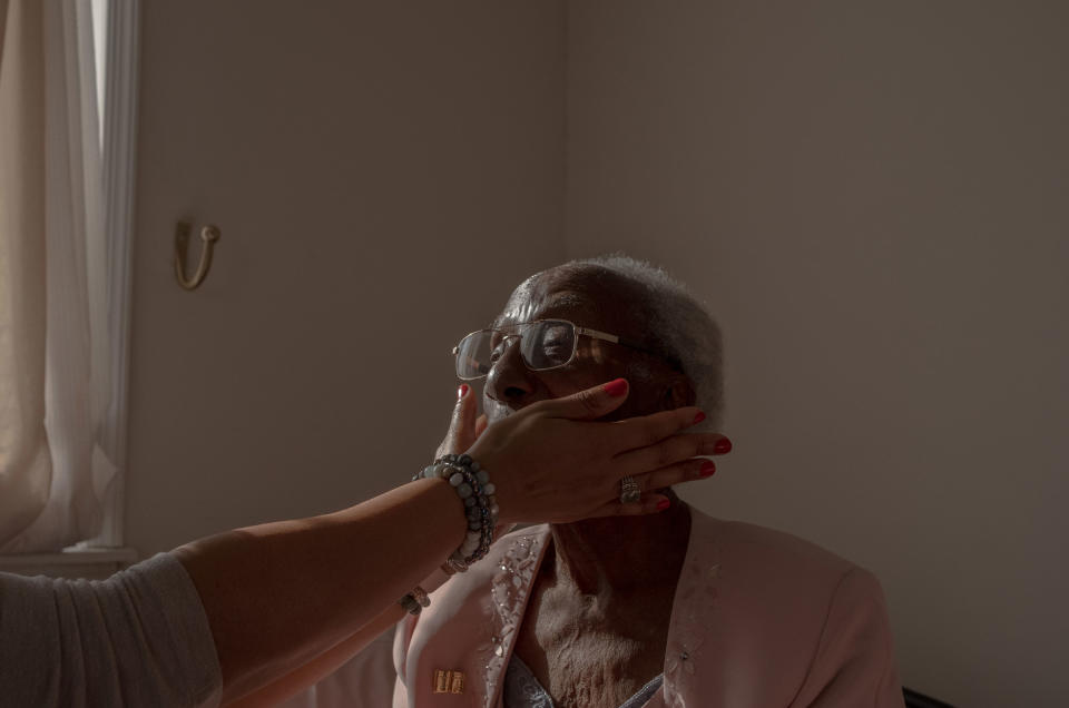 End-of-life doula Michelle Thornhill meets with her client, Estella Stackhouse, 101, at Stackhouse’s home in Philadelphia, on Jan. 19.<span class="copyright">September Dawn Bottoms for TIME</span>