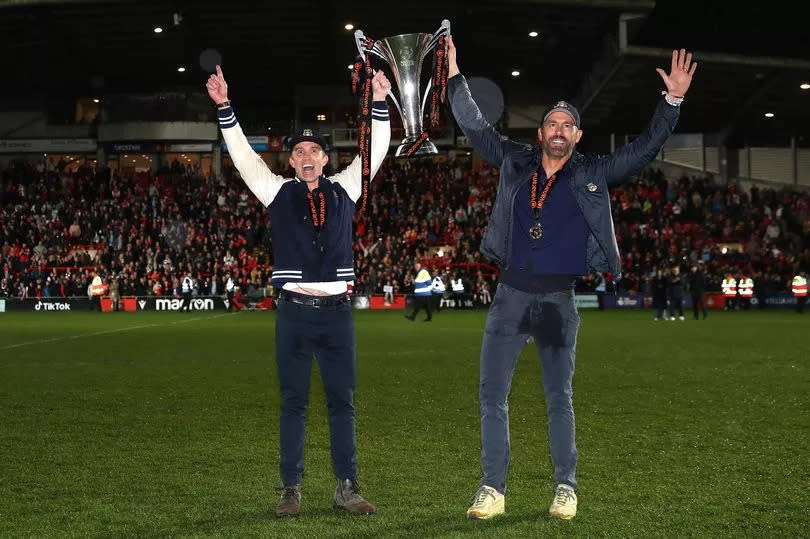 Rob McElhenney and Ryan Reynolds, Owners of Wrexham celebrate with the Vanarama National League trophy as Wrexham win the Vanarama National League