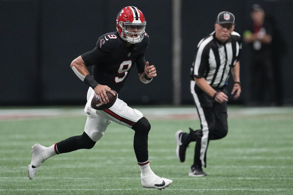 Atlanta Falcons quarterback Desmond Ridder (9) runs out of the pocket against the Green Bay Packers during the first half of an NFL football game, Sunday, Sept. 17, 2023, in Atlanta. (AP Photo/John Bazemore)