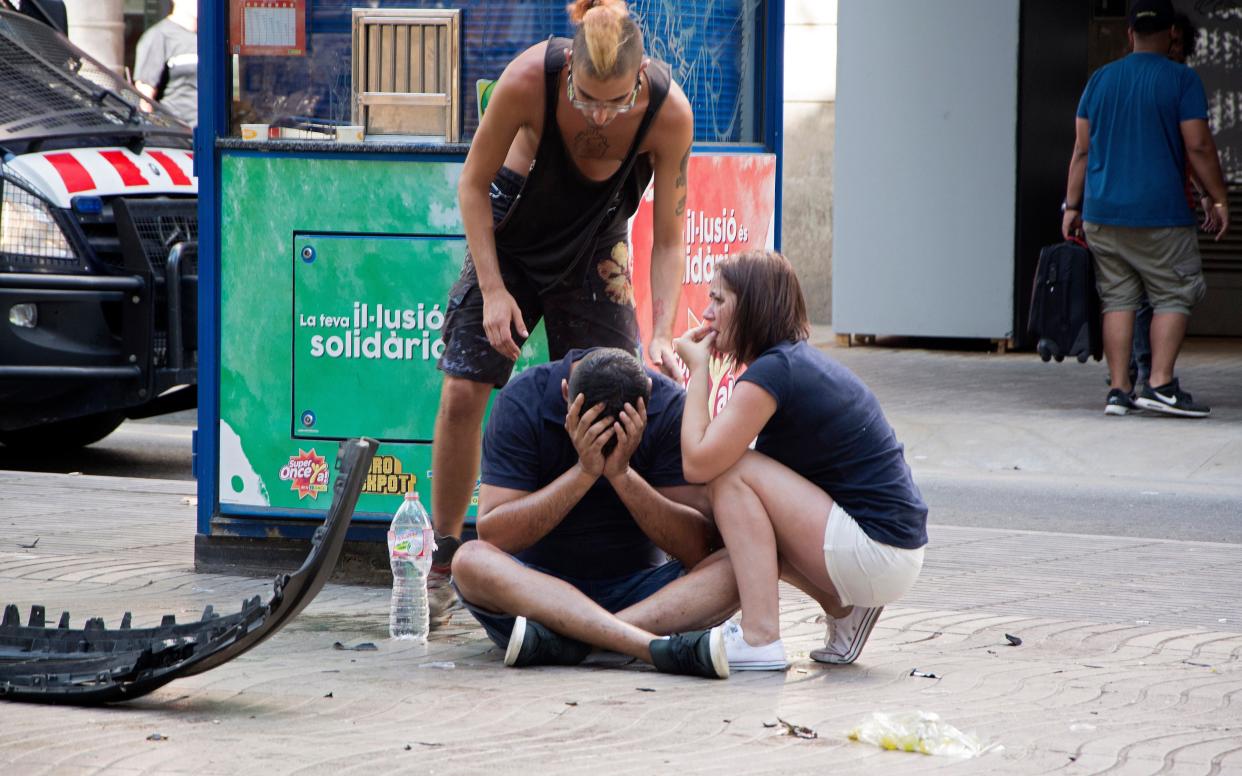 Injured people react after a van crashed into pedestrians in Las Ramblas, downtown Barcelona, Spain, 17 August 2017 - EPA/David Armengou