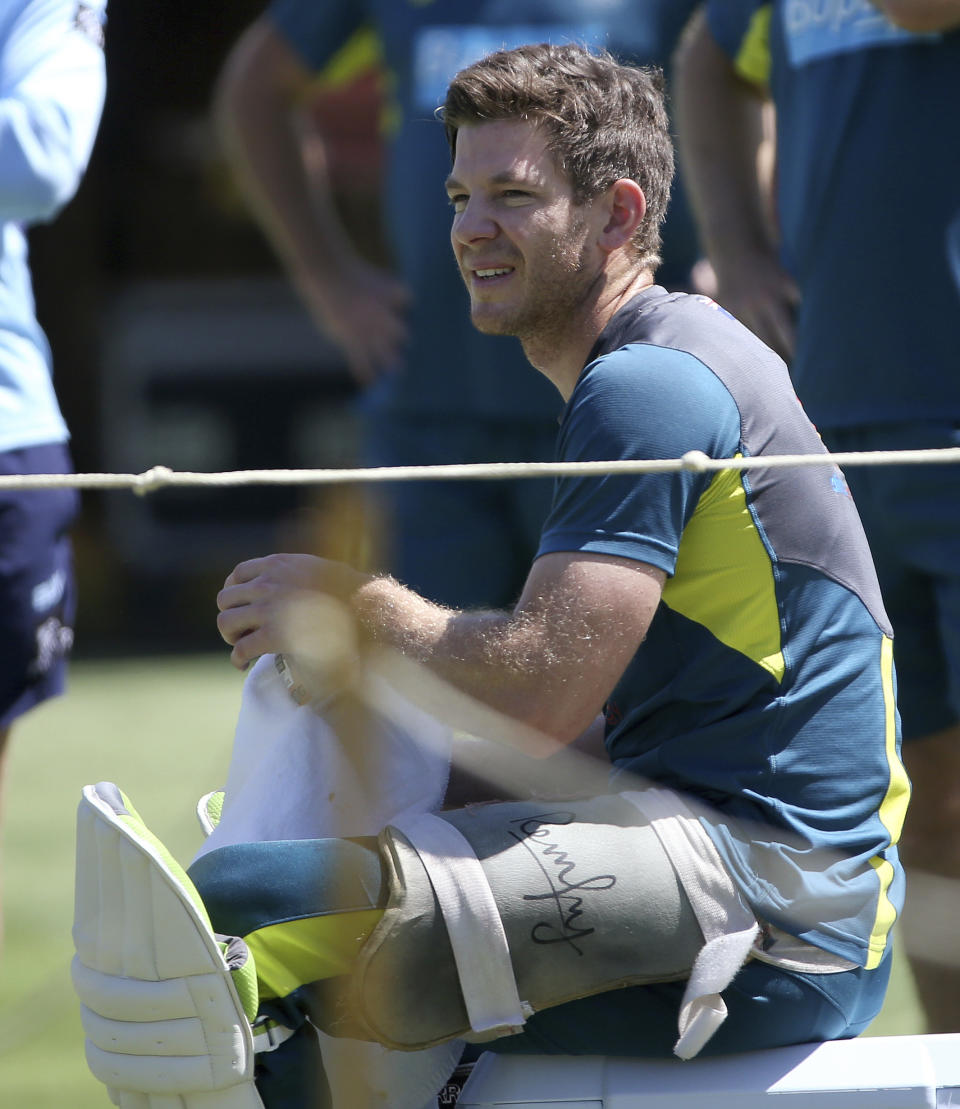 Australia's Tim Paine takes a break from batting during an optional training session in the nets in Sydney, Tuesday, Jan. 1, 2019, ahead of their cricket test match against India starting Jan. 3. (AP Photo/Rick Rycroft)