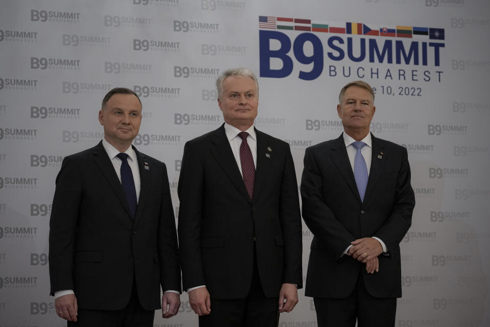 From left, Polish President Andrzej Duda, Lithuania's President Gitanas Nauseda and Romania's President Klaus Iohannis pose before the Bucharest Nine (B9) Summit at the Cotroceni Presidential Palace in Bucharest, Romania, Friday, June 10, 2022. (AP Photo/Andreea Alexandru)