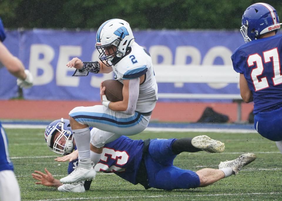 Westlake's Nicholas DiNapoli (2) works around Pearl River's Danny Fitzgerald (33) during football action at Pearl River High School on Saturday, September 28, 2024. Westlake won 33-21.