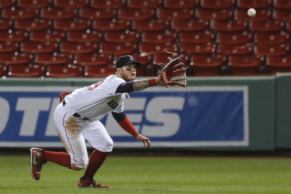 Boston Red Sox's Alex Verdugo makes the catch on the line out by Toronto Blue Jays' Danny Jansen during the ninth inning of a baseball game, Friday, Aug. 7, 2020, in Boston. (AP Photo/Michael Dwyer)