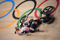 Katy Marchant of Team Great Britain crashes with Laurine van Riessen of Team Netherlands (188) during the track cycling women keirin at the 2020 Summer Olympics, Thursday, Aug. 5, 2021, in Izu, Japan. (AP Photo/Christophe Ena)