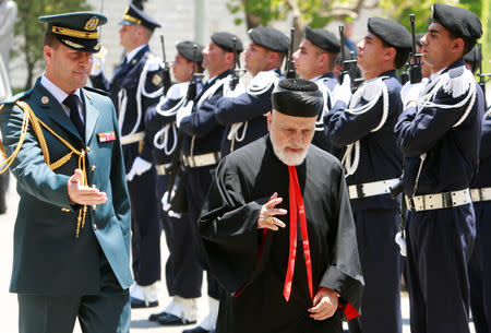 FILE PHOTO: Lebanon's Christian Maronite Patriarch Cardinal Mar Nasrallah Boutros Sfeir reviews an honour guard upon arriving at the presidential palace in Baabda, east of Beirut, June 24, 2008 for a religious meeting between Muslims and Christians. REUTERS/Jamal Saidi/File Photo