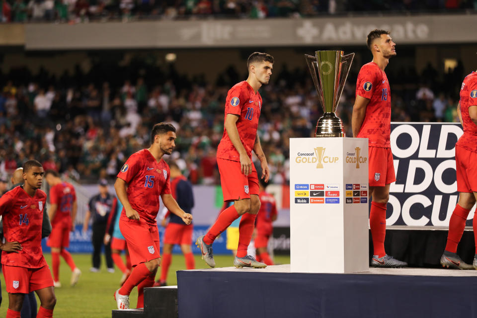 CHICAGO, IL - JULY 07: Christian Pulisic of USA walks past the CONCACAF Gold Cup trophy after USA's 0-1 defeat to Mexico in the 2019 CONCACAF Gold Cup Final between Mexico and United States of America at Soldier Field on July 7, 2019 in Chicago, Illinois. (Photo by Matthew Ashton - AMA/Getty Images)