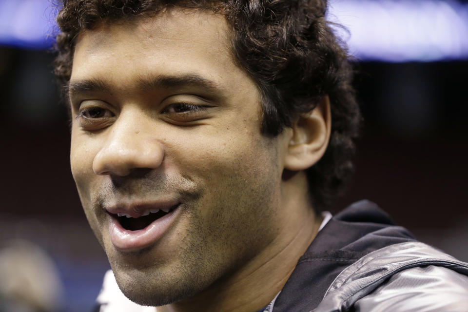 Seattle Seahawks' Russell Wilson answers a question during media day for the NFL Super Bowl XLVIII football game Tuesday, Jan. 28, 2014, in Newark, N.J. (AP Photo/Mark Humphrey)
